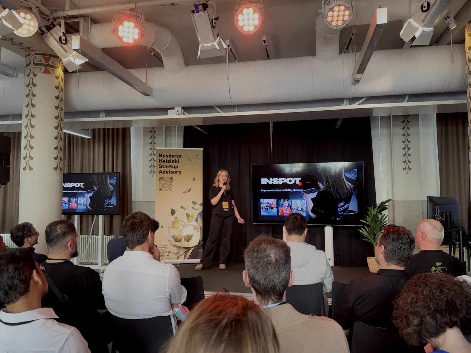 Inspot pitch on stage in front of an event audience